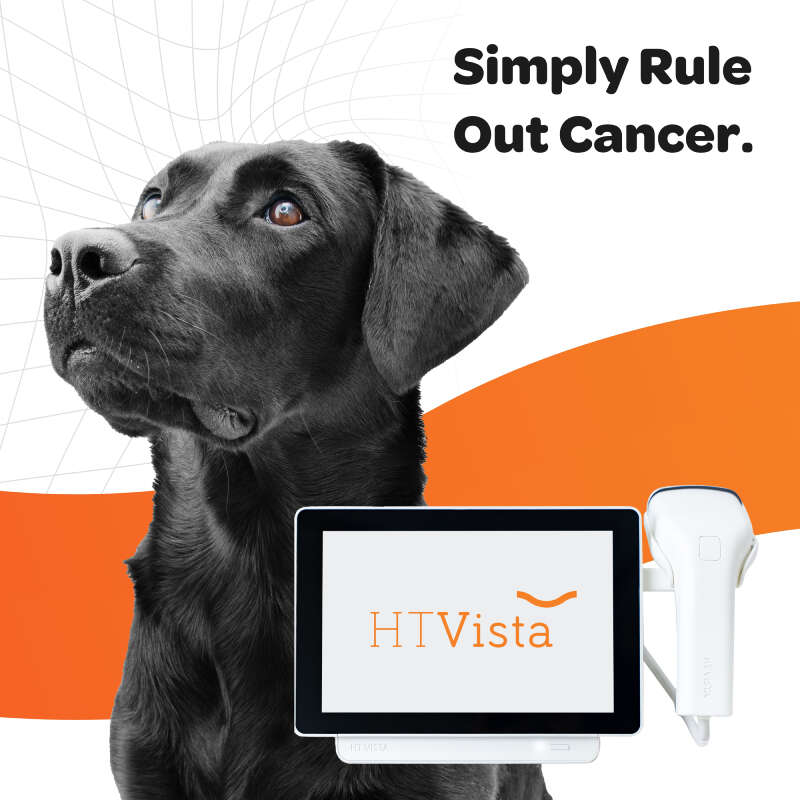 A black Labrador retriever alongside a medical device displaying "HTVista" and the text "Simply Rule Out Cancer.